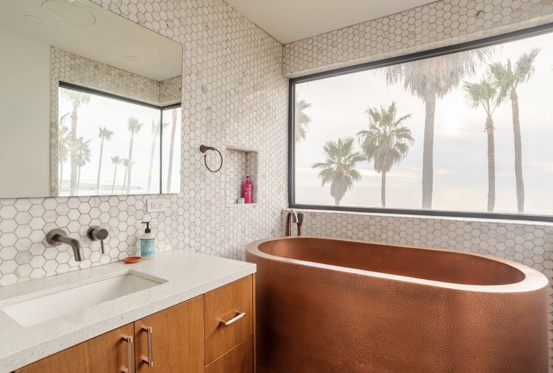 Copper tub bathroom with ocean view