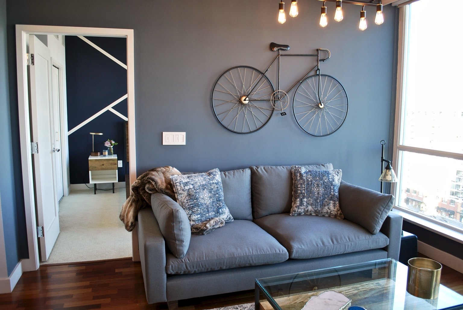 Blue living wall with bicycle art