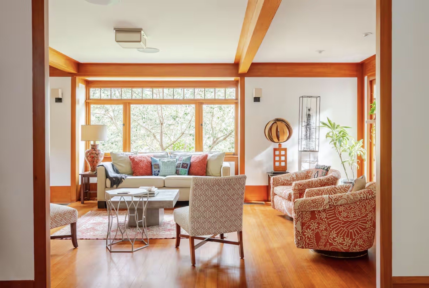 Eclectic formal sitting room with historic wood details