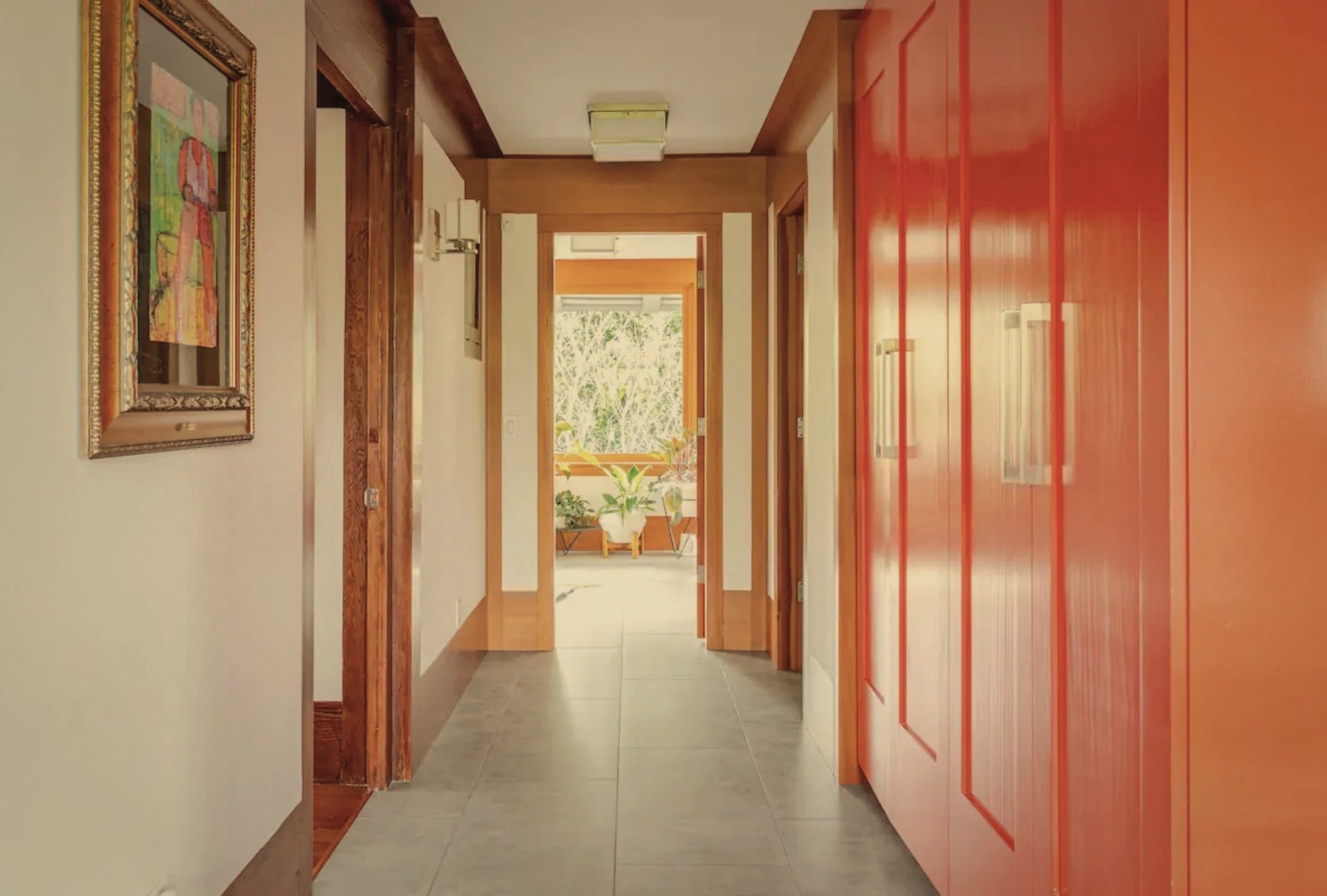 Irving Gill Residence hallway with red cabinetry
